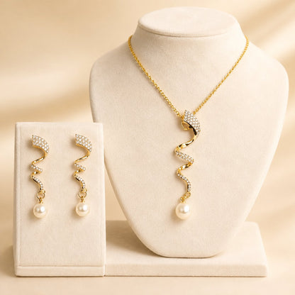 Aurelia Pearl Drop necklace and earring set displayed on a velvet bust