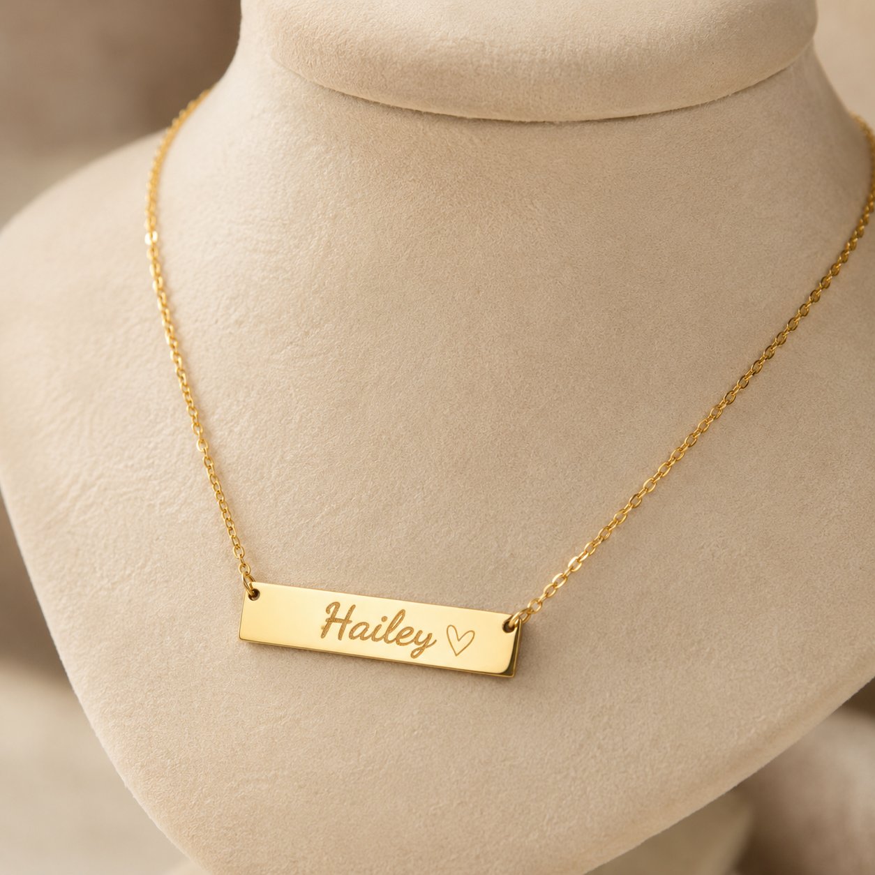 Custom Name Bar Necklace engraved on a display bust