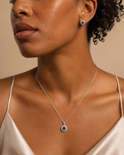 Model wearing the Celeste Sapphire Halo Set, alternate close up